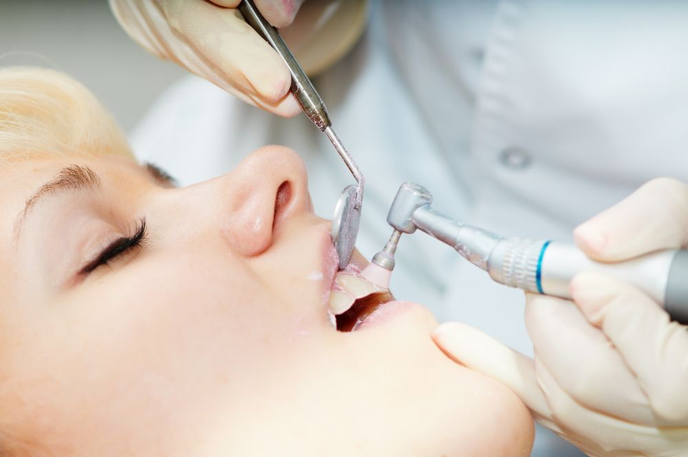 Woman receiving dental cleaning